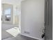 Bright foyer with tile floors, leading into a living room with large windows that provide ample natural light at 10174 Spotted Owl Ave, Highlands Ranch, CO 80129