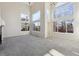 Bright and airy living room featuring soaring ceilings and many windows for natural light at 10174 Spotted Owl Ave, Highlands Ranch, CO 80129