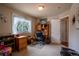 Bright bedroom with carpeted floors, a window with sheer curtains, and ample space for a productive workspace at 2151 Burbank St, Berthoud, CO 80513