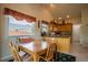 Inviting breakfast nook adjacent to the kitchen, perfect for casual dining and entertaining at 2151 Burbank St, Berthoud, CO 80513