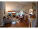 A spacious living room with hardwood floors, a fireplace, and vaulted ceilings at 2151 Burbank St, Berthoud, CO 80513