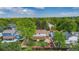 Aerial view of a home with a spacious backyard, patio area, and lush green surroundings at 7655 S Ogden Way, Centennial, CO 80122
