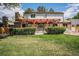 Manicured backyard features a covered patio and mature landscaping for outdoor enjoyment at 7655 S Ogden Way, Centennial, CO 80122