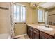 Bathroom featuring a vanity, mirror, and a shower with floral shower curtain at 7655 S Ogden Way, Centennial, CO 80122