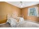 Bedroom featuring a window and a carpeted floor at 7655 S Ogden Way, Centennial, CO 80122