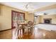 Dining room with wooden table set, tile flooring, ceiling fan, and access to the back yard at 7655 S Ogden Way, Centennial, CO 80122