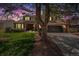 Lovely two-story home with a well-kept lawn, mature trees, and a welcoming front porch at 7655 S Ogden Way, Centennial, CO 80122
