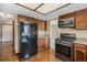 View of kitchen showcasing stainless steel appliances and wood cabinets and breakfast nook area at 7655 S Ogden Way, Centennial, CO 80122