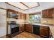 Picture of the kitchen with granite counters, wood cabinets and stainless steel appliances at 7655 S Ogden Way, Centennial, CO 80122