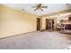 Open floor plan shows living room flowing into dining room with view of kitchen at 7655 S Ogden Way, Centennial, CO 80122