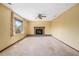 Living room featuring neutral paint, carpet floors, a fireplace, and a large window at 7655 S Ogden Way, Centennial, CO 80122
