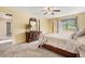 Comfortable bedroom featuring a four-poster bed, window, and dresser at 7655 S Ogden Way, Centennial, CO 80122