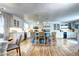 Open-concept kitchen with a large island, stainless steel appliances, and a beverage area at 8581 W Hinsdale Pl, Littleton, CO 80128