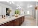 Bathroom featuring a double vanity, granite countertop, soaking tub and walk-in shower at 23101 Timber Spring Ln, Parker, CO 80138