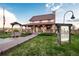 Charming coffee house exterior with inviting porch, stone details, and well-manicured lawn at 23101 Timber Spring Ln, Parker, CO 80138