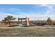 Scenic community overlook features a stone structure offering panoramic views of the neighborhood and distant mountains at 23101 Timber Spring Ln, Parker, CO 80138