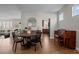 Elegant dining room featuring a round table, hardwood floors, and easy access to the kitchen at 23101 Timber Spring Ln, Parker, CO 80138