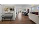 Welcoming entryway showcasing hardwood floors, neutral walls, and a glimpse into the dining area at 23101 Timber Spring Ln, Parker, CO 80138