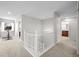 Bright hallway with access to various rooms, featuring a staircase and neutral color palette at 23101 Timber Spring Ln, Parker, CO 80138