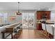 Bright kitchen with a breakfast bar and sliding glass doors leading to the outdoor space at 23101 Timber Spring Ln, Parker, CO 80138