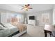 Spacious main bedroom with plush carpeting, large windows, and a view at 23101 Timber Spring Ln, Parker, CO 80138