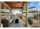 Relaxing covered porch with comfortable seating and decorative accents is perfect for enjoying the outdoors at 23101 Timber Spring Ln, Parker, CO 80138