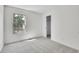 Bright bedroom featuring a large window for natural light and a sliding-door closet at 9946 Harrison St, Thornton, CO 80229