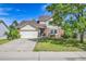 Charming two-story home with a well-manicured lawn, driveway, and attached two-car garage at 9946 Harrison St, Thornton, CO 80229