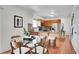 Bright kitchen area with breakfast bar and stainless steel appliances with hardwood floors at 9946 Harrison St, Thornton, CO 80229