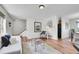 Bright living room featuring hardwood floors, neutral paint, and stylish furniture at 9946 Harrison St, Thornton, CO 80229