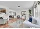 Bright and airy living room with hardwood floors and modern decor at 9946 Harrison St, Thornton, CO 80229