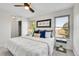 Bright, comfortable bedroom with large windows and tasteful decor at 9946 Harrison St, Thornton, CO 80229