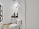 Cozy powder room with granite countertop and decorative accents at 9946 Harrison St, Thornton, CO 80229