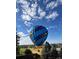 Unique hot air balloon view of the neighborhood with blue skies and mountain views at 1348 Lawson Ave, Erie, CO 80516