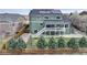 A spacious backyard featuring a large deck, mature trees, and privacy fencing at 1348 Lawson Ave, Erie, CO 80516