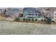 Spacious backyard with a large yard, wooden fence, and pine trees at 1348 Lawson Ave, Erie, CO 80516