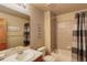 Full bathroom featuring a tub, shower, vanity with sink, providing a relaxing and practical space at 1348 Lawson Ave, Erie, CO 80516