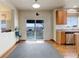 Bright dining area with sliding glass doors to a deck and scenic mountain views at 1348 Lawson Ave, Erie, CO 80516