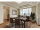 Inviting dining room featuring hardwood floors, tray ceiling, and lots of natural light at 1348 Lawson Ave, Erie, CO 80516