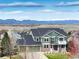 Stunning two-story home boasts a three-car garage and mountain views at 1348 Lawson Ave, Erie, CO 80516