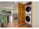 Conveniently located laundry area with stacked washer and dryer units, perfect for simplifying chores at 1348 Lawson Ave, Erie, CO 80516