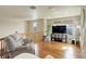 Upstairs bonus living room with hardwood floors, chair, and a large tv for comfort at 1348 Lawson Ave, Erie, CO 80516