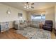 Spacious living room with ample seating, large windows, and a ceiling fan at 1348 Lawson Ave, Erie, CO 80516