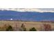Breathtaking mountain views overlooking the neighborhood with snow-capped peaks at 1348 Lawson Ave, Erie, CO 80516