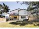 Expansive backyard with a well-maintained lawn, patio, grill, and hot tub, perfect for outdoor enjoyment at 3427 S Cherry St, Denver, CO 80222
