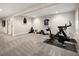 Basement gym with carpet, neutral paint, and exercise equipment at 3427 S Cherry St, Denver, CO 80222