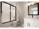 Bathroom featuring a tub and shower combination, paired with a pristine white vanity at 3427 S Cherry St, Denver, CO 80222