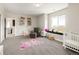 Bright bedroom featuring a window seat, playful decor, and a butterfly rug at 3427 S Cherry St, Denver, CO 80222