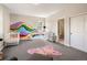 Spacious bedroom featuring unique wall art and a light-filled, airy atmosphere at 3427 S Cherry St, Denver, CO 80222