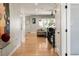 Entryway featuring wood floors, glass top furniture, and an open floorplan at 3427 S Cherry St, Denver, CO 80222